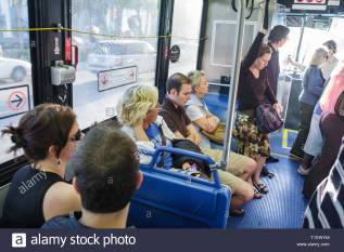 miami-beach-florida-metrobus-south-beach-local-bus-woman-man-seniors-sitting-standing-seats-public-transportation-mass-transit-p-T1EWYM